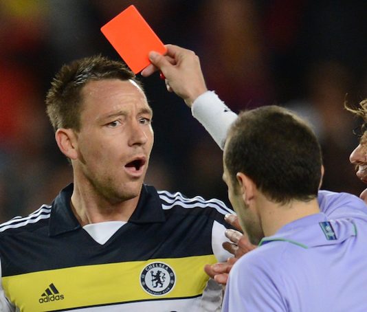 Chelsea's defender John Terry receives a red card from Turkish referee Cuneyt Cakir